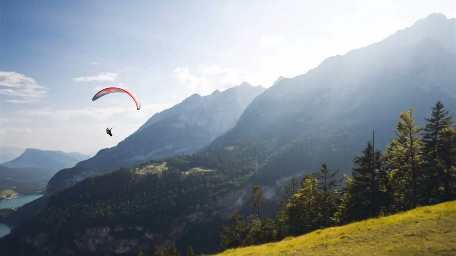 Tandem paraglider flight above Lake Molveno