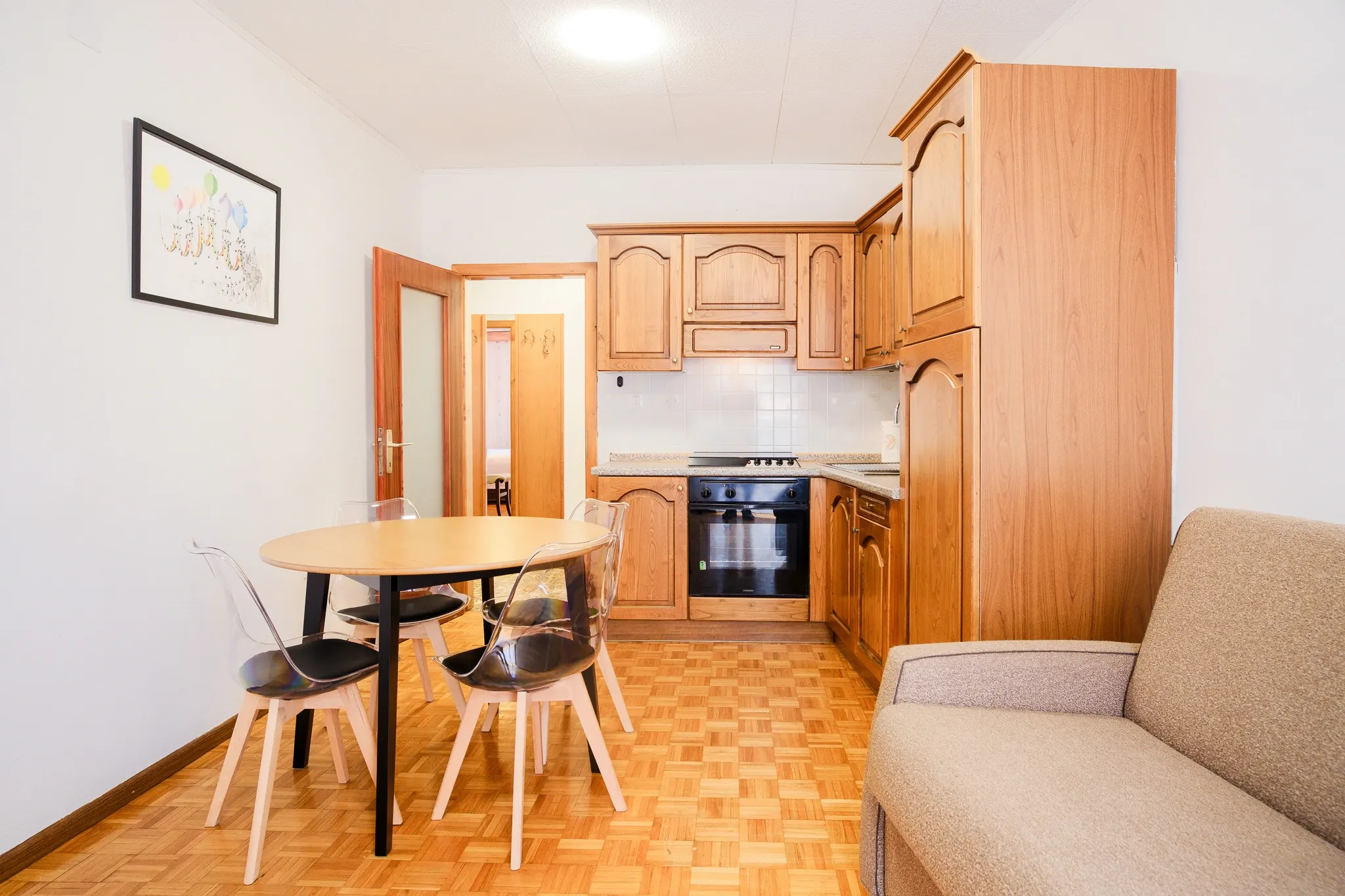 The Ruta living room and wooden kitchen